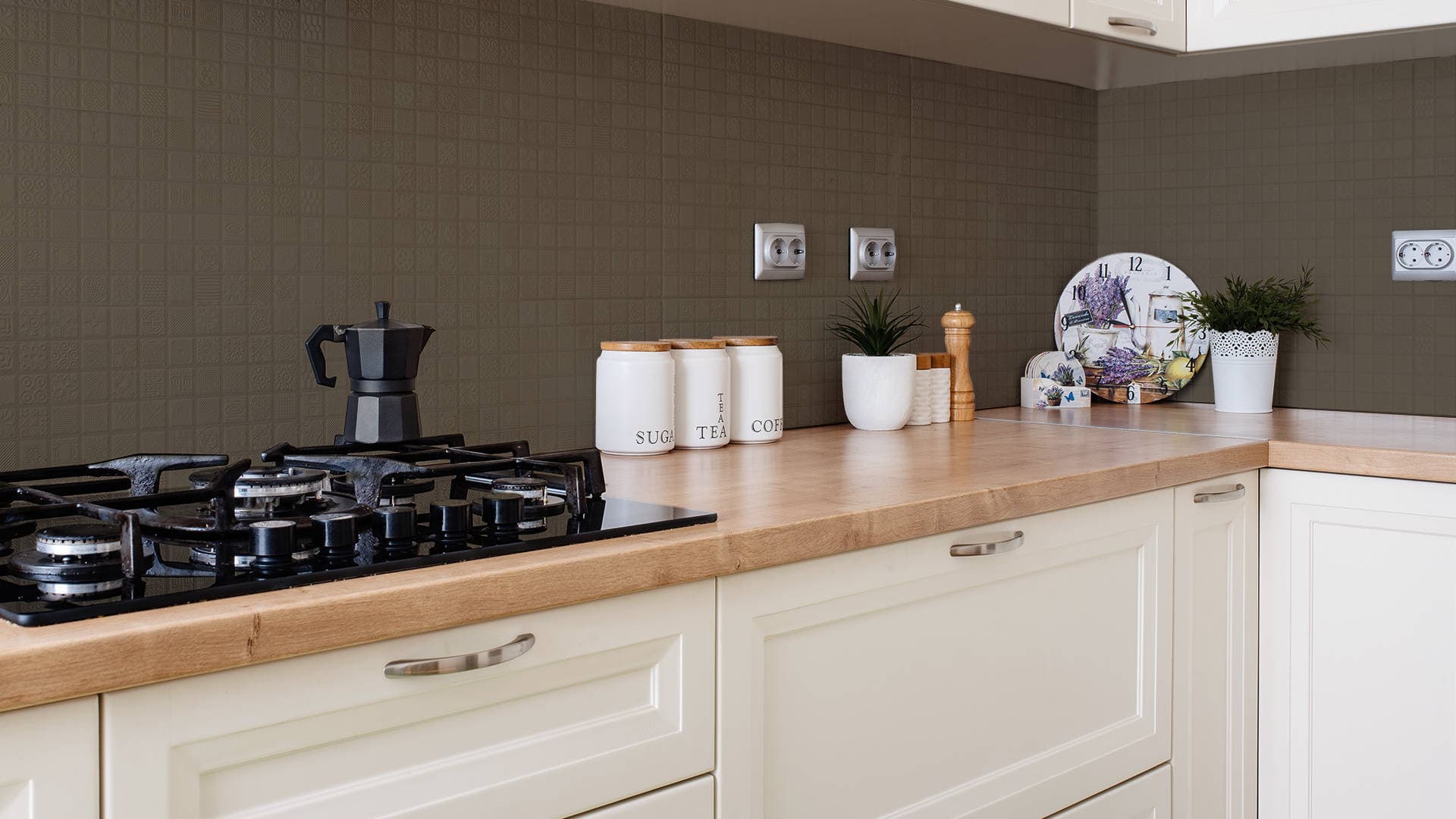 kitchen wall with brown painted tiles