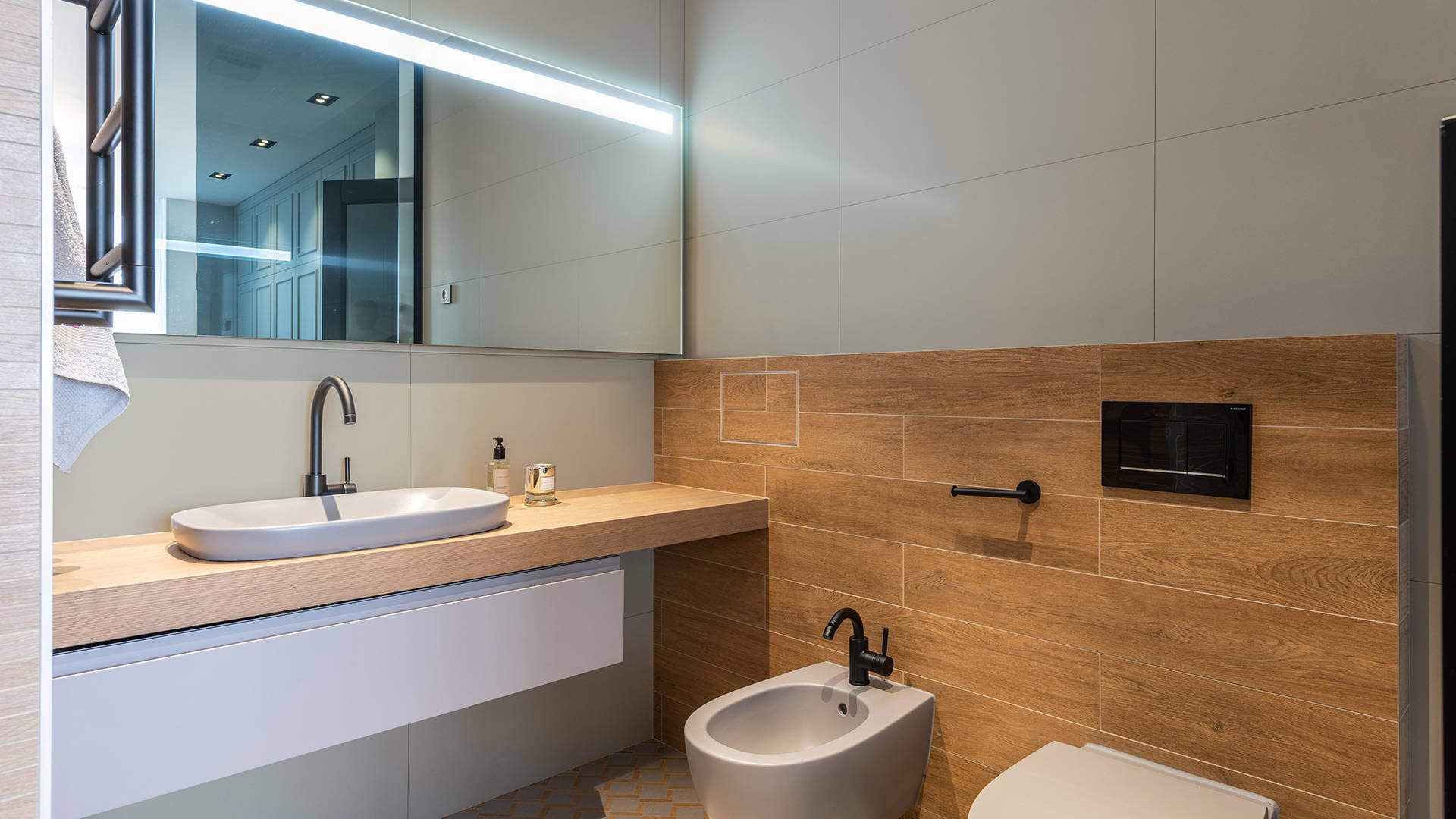 bathroom with wood and painted tiles