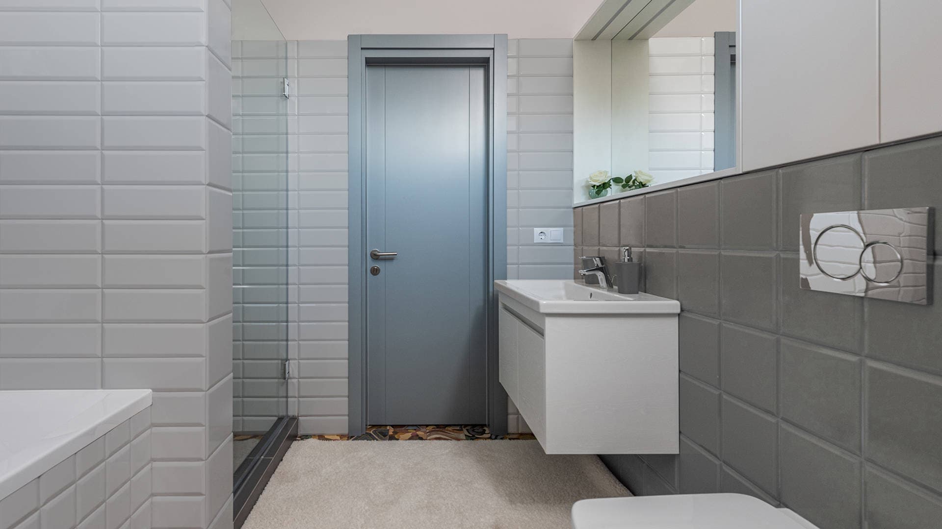 large bathroom with painted tiles