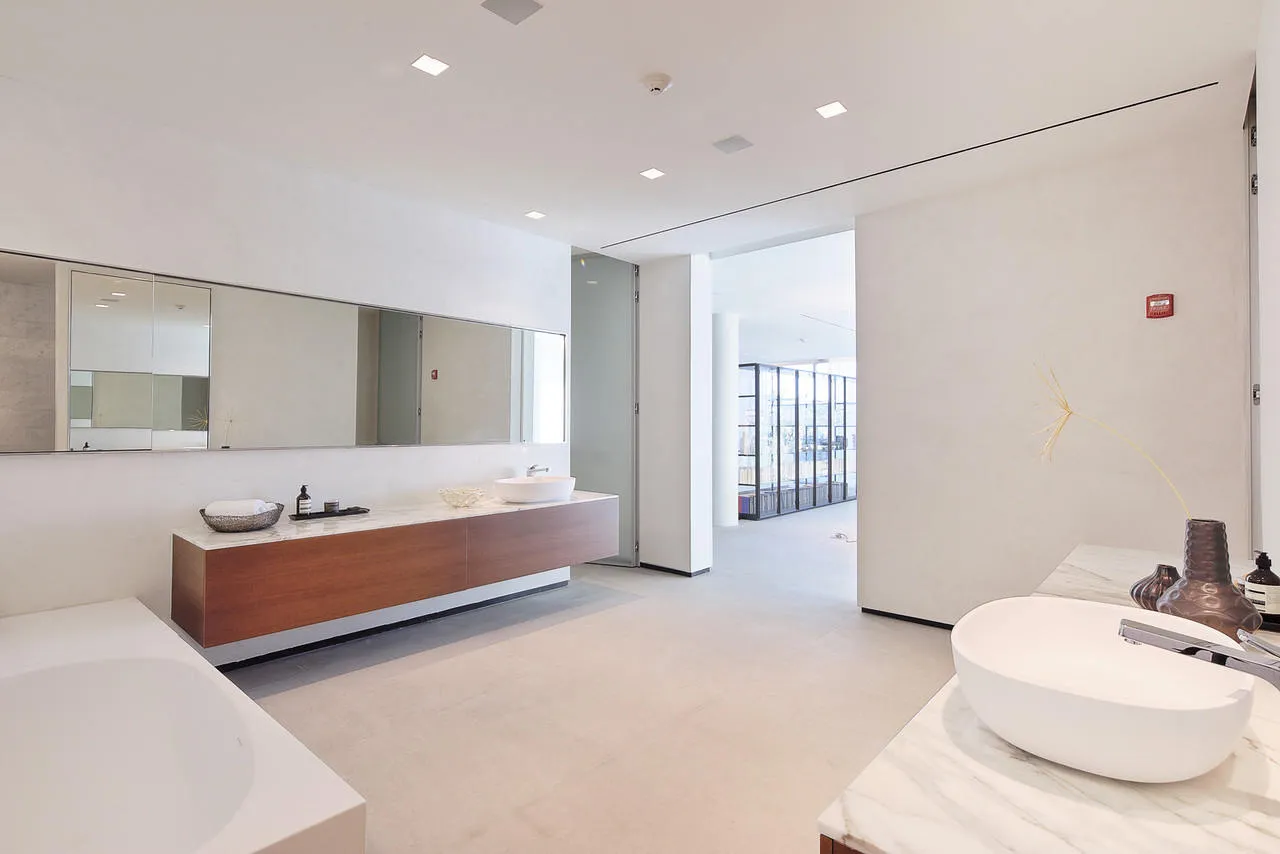 large bathroom with microcement on walls large bathroom with microcement on walls