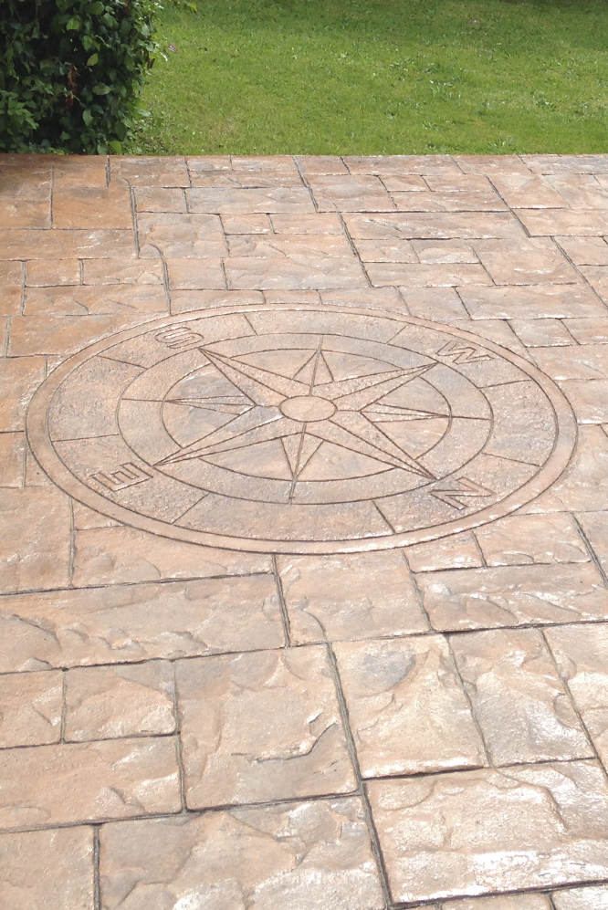 stamped concrete floor with compass rose design 